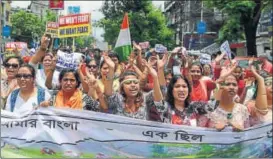  ?? AFP ?? Supporters of TMC and other outfits march in Siliguri on Sunday for an end to violence in Darjeeling.