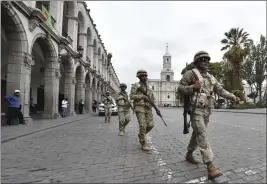  ?? JOSE SOTOMAYOR — THE ASSOCIATED PRESS ?? Soldiers patrol in Arequipa, Peru, on Wednesday.