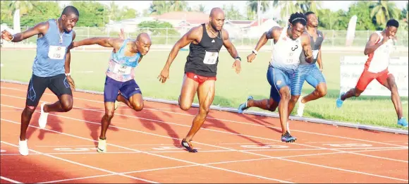  ??  ?? Silver medalist at the 2014 Central American and Caribbean Games, 21 year-old Levi Cadogan (lane 6) upsets Kim Collins (lane 5) to take the spoils in the marquee 100m event in a close finish. (Orlando Charles photo)