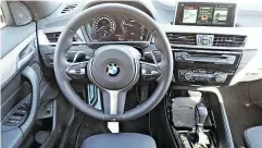  ??  ?? There’s plenty of feedback in the steering wheel and the interior of the BMW X28 is roomy.