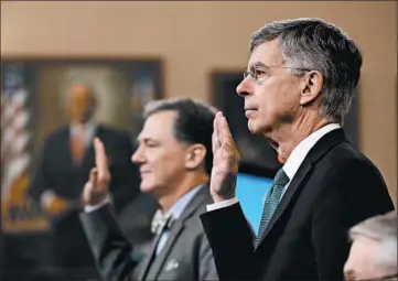  ?? DREW ANGERER/GETTY ?? George Kent, left, and Bill Taylor are sworn in to testify before the House Intelligen­ce Committee on Wednesday.