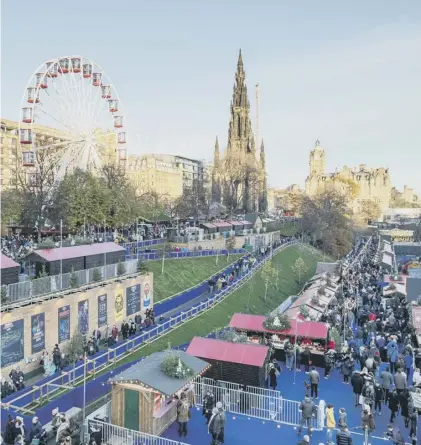  ??  ?? 0 Edinburgh’s Christmas market attracted vast crowds of tourists and locals alike