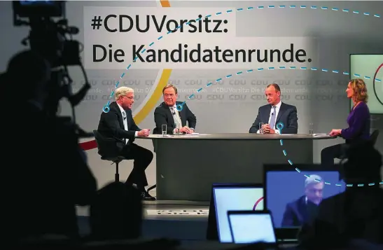  ?? REUTERS ?? Los tres aspirantes para suceder a Angela Merkel al frente de la CDU en un debate