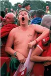  ?? REUTERS ?? Welsh supporters respond to a goal against Belgium at a fanzone in Cardiff.