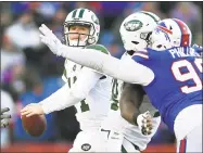  ?? Adrian Kraus / Associated Press ?? Jets quarterbac­k Sam Darnold passes under pressure against the Bills Sunday in Orhard Park, N.Y.