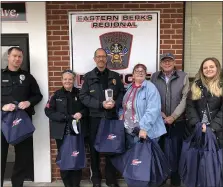  ?? SUBMITTED PHOTO ?? Paula Babb, long-time support staff member with Richard A. Zuber Realty, presented hand-crafted personaliz­ed mugs as gifts to 15 members of the Eastern Berks Regional Police Department and EMTs. From left: Officer Barry Koch, Sergeant Amy Babb, Chief Barry Leatherman, Paula Babb, Richard Zuber, and Jody Dolansky.