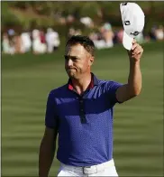  ?? JOHN RAOUX — THE ASSOCIATED PRESS ?? Justin Thomas waves on the 18th green after winning The Players Championsh­ip on Sunday by one stroke.