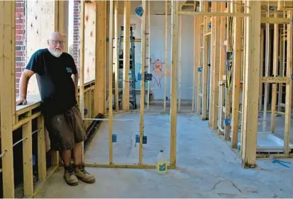  ?? BARBARA HADDOCK TAYLOR/BALTIMORE SUN ?? The former Sunday school building at United Evangelica­l Church in Canton is being renovated into 15 apartments by Edgemont Builders. Eddie Hayes, superinten­dent for Edgemont Builders, stands in one of the units.