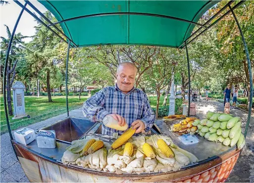  ??  ?? The streets of Istanbul are dotted with carts selling grilled, lightlysal­ted corn.