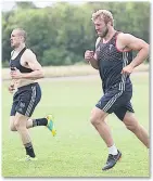  ??  ?? QUIN &amp; BEAR IT: Brown alongside Chris Robshaw during a training-ground run