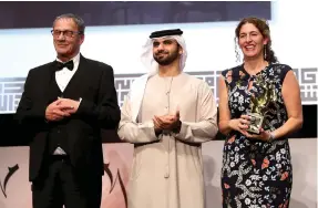  ?? Getty for Diff ?? Winner of the Muhr Award for Best Fiction Feature, Annemarie Jacir, with Mohammad Bakri, left, and Sheikh Mansoor bin Mohammed bin Rashid Al Maktoum