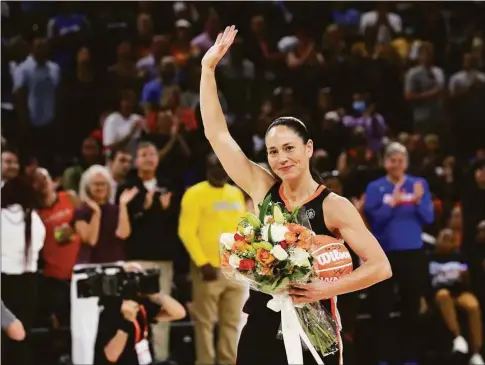  ?? Stacey Wescott / Associated Press ?? The Seattle Storm’s Sue Bird waves to the crowd after receiving a bouquet of flowers at the All-Star Game on July 10.