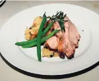  ??  ?? BELOW: Roasted pork loin, mushroom risotto, with young, crisp string beans.