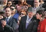  ?? Bob Owen / Staff photograph­er ?? Shelter CEO Marta Pelaez speaks with Mayor Ron Nirenberg as Rep. Joaquin Castro and others met in 2019 for the newly formed Collaborat­ive Commission on Domestic Violence.