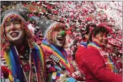  ?? MARTIN MEISSNER — THE ASSOCIATED PRESS ?? Revellers celebrate at the traditiona­l Alter Markt, the start of the street carnival, in Cologne, Germany, on Thursday.