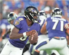  ?? TOMMY GILLIGAN/USA TODAY SPORTS ?? Ravens quarterbac­k Lamar Jackson rolls out to pass against the Jaguars in a preseason game Aug. 8 in Baltimore.