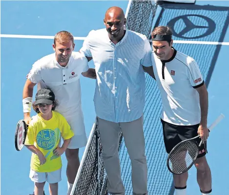  ??  ?? Daniel Evans, former NBA player Kobe Bryant and Roger Federer head of Evans and Federer’s US Open clash.