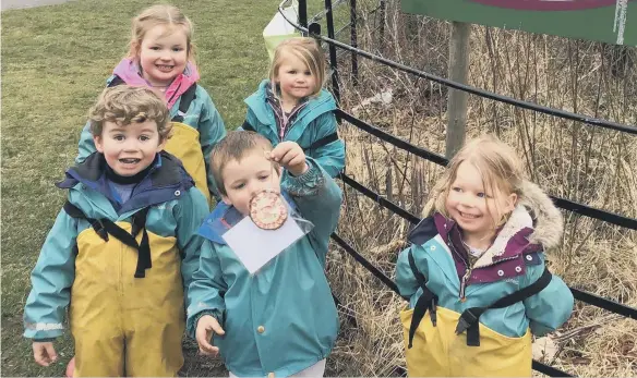  ??  ?? Children from Saplings Kindergart­en finding a kindness cookie./Photo: Saplings Nature Kindergart­en & Forest School CIC