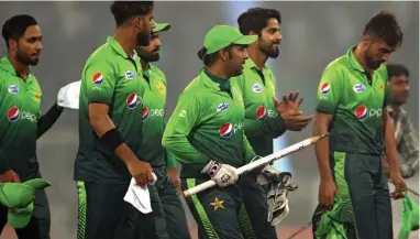  ?? EPA ?? BACK AS HOSTS: Pakistan celebrate after winning the final T20 internatio­nal against Sri Lanka in Lahore, after almost eight years of being denied ‘home’ status.