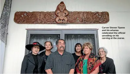  ??  ?? Carver Steven Tipene and his whanau celebrated the official unveiling on his carving at the marae.