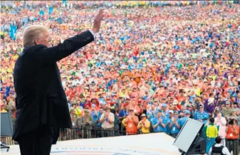  ?? Saul Loeb / AFP / Getty Images ?? President Trump waves after speaking to Boy Scouts during the National Boy Scout Jamboree at Summit Bechtel National Scout Reserve on Monday in Glen Jean, W.Va.