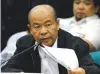  ??  ?? CONFESSED KILLER Arturo B. Lascañas holds a document as he testifies at the Senate.