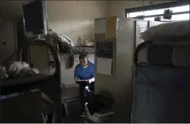  ?? JAE C. HONG — THE ASSOCIATED PRESS ?? Joseph Sena, 27, reads a document in his cell at Valley State Prison in Chowchilla on Nov. 4. Sena spent years trying to make himself a better person after spending nearly half of his 27 years in prison for killing a man.