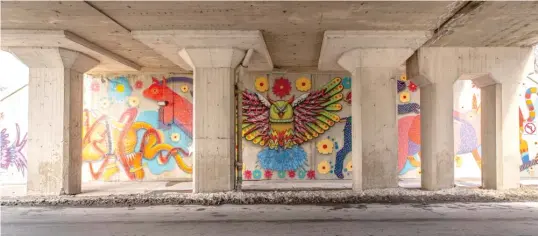  ?? ?? ABOVE: Ali Cantarella’s mural on a utility box.
BELOW: Mexican folk art images adorn a viaduct wall.