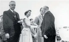  ?? Photo / Te Awamutu Museum ?? Kihikihi Town Board chairman Gus Maunder meets Her Majesty Queen Elizabeth II and the Duke of Edinburgh, Prince Phillip, on New Year’s Day, 1954 during the Royal Visit to Te Awamutu. At left is Te Awamutu Mayor Cliff Jacobs.