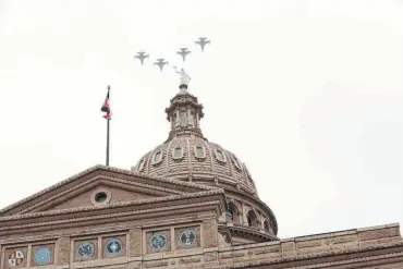  ?? Bob Owen / Staff photograph­er ?? Jets roar over the Capitol as a salute during Gov. Greg Abbott’s inaugurati­on ceremony.