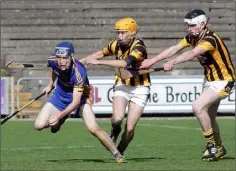  ??  ?? Seán ‘Mini’ Ryan gives Eoghan Fitzgerald and Eoin O’Leary the slip.