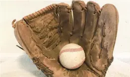  ?? ?? The glove given to the author by Cubs pitcher Oscar Zamora.