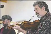  ?? AP/Republican-Herald/ANDY MATSKO ?? Vinegar Creek Constituen­cy, a string band, performs bluegrass and folk music during an event Sunday in Pine Grove, Pa.