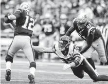  ?? Brett Coomer / Staff photograph­er ?? Although Patriots quarterbac­k Tom Brady, left, remains out of his reach, J.J. Watt left the field feeling good about his health.