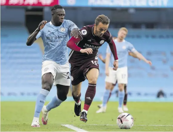  ?? (photos: afp) ?? Leicester City’s English midfielder James Maddison (right) is fouled by Manchester City’s French defender Benjamin Mendy for Leicester’s third penalty of the English Premier League football match at Etihad Stadium in Manchester, north-west England, yesterday. Leicester won the game 5-2.