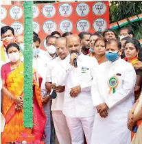  ??  ?? BJP state president Bandi Sanjay Kumar hoists the flag at the party office in Hyderabad on Sunday.