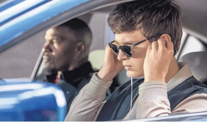  ?? COURTESY OF WILSON WEBB/SONY/TRISTAR PICTURES ?? Ansel Elgort, right, and Jamie Foxx in a scene from “Baby Driver.”