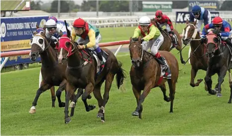  ?? PHOTO: KEVIN FARMER ?? GOT THERE: Teeroys Tribute comes with a powerful finish for jockey Kenji Yoshida to win the Class 1 Handicap at Clifford Park in January.