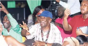  ?? SHORN HECTOR/FREELANCE PHOTOGRAPH­ER ?? Residents of central Kingston reacting to comments during a government-organised townhall meeting at National Heroes Park on Thursday night.