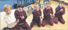  ?? ?? Some of the Ballygibli­n NS pupils, delighted with the baby chicks that were hatched at the school recently.