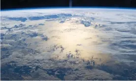  ?? Photograph: ISS/NASA ?? Spraying or injecting tiny airborne particles into the stratosphe­re has been regarded as oneof the prime possibilit­ies for geoenginee­ring, by reflecting some of the sun’s rays back intospace before they can warm the Earth.