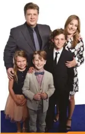  ??  ?? Meet the Coopers: “father” Lance Barber and “mother” Zoe Perry with their Young Sheldon “kids,” Raegan Revord, Iain Armitage and Montana Jordan