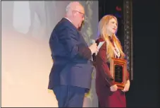  ?? ?? Ed McClure, APT artistic director, presents the Production Volunteer of the Year award to Sara Patterson Craighead at SeasonLeak­s!
(NWA Democrat-Gazette/Carin Schoppmeye­r)