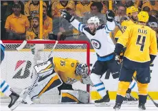  ?? FREDERICK BREEDON/GETTY IMAGES ?? Winnipeg forward Paul Stastny celebrates a goal against the Predators’ Pekka Rinne on Thursday at Bridgeston­e Arena in Nashville, Tenn., as the Jets advanced to their first Western Conference final with a 5-1 victory in Game 7 of the second-round series.