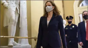  ??  ?? Judge Amy Coney Barrett, President Donald Trump’s nominee for the Supreme Court, arrives at the Capitol on Wednesday for meetings with several senators.
(AP/J. Scott Applewhite)