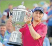  ?? AP ?? Justin Thomas poses with the Wanamaker Trophy after winning the PGA Championsh­ip at the Quail Hollow Club on Sunday.
