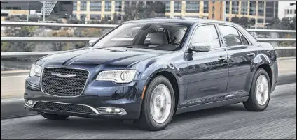  ?? A. J. MUELLER / CHRYSLER ?? The bolder “face of Chrysler” mesh grille, sitting in the more-sculpted front fascia, is one-third larger, and the Chrylser wing has moved down toward the center of the grille.