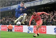  ?? PHOTO: AFP ?? Chelsea’s Cole Palmer, left, vies for the ball with Everton’s Dwight McNeil in their English Premier League match at Stamford Bridge in London on Monday.