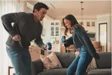  ?? Bud Light/Associated Press ?? Miles Teller and Keleigh Sperry Teller dance to customer service hold music for this year’s Bud Light Super Bowl commercial.