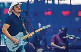  ?? Steve Gonzales / Houston Chronicle ?? Brad Paisley performed at RodeoHoust­on for the 11th time on Saturday, peppering his show with hit songs, humor and selfies.